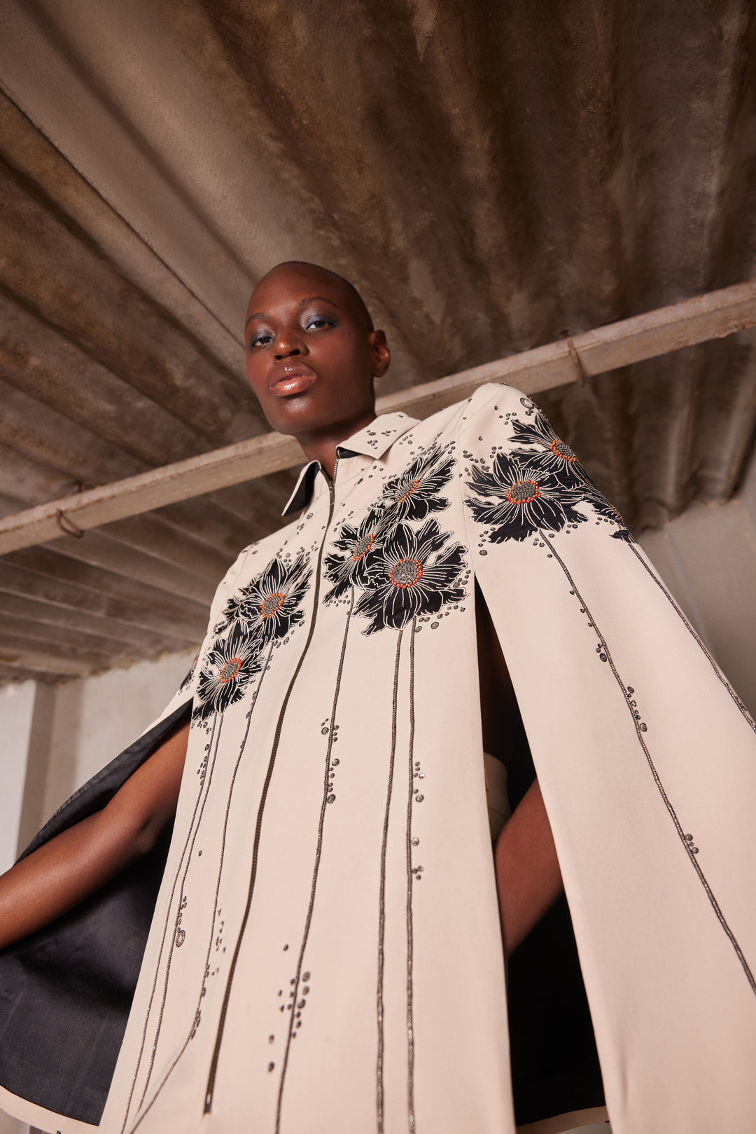 FLORAL PATCH CAPE WITH FLARED PANTS