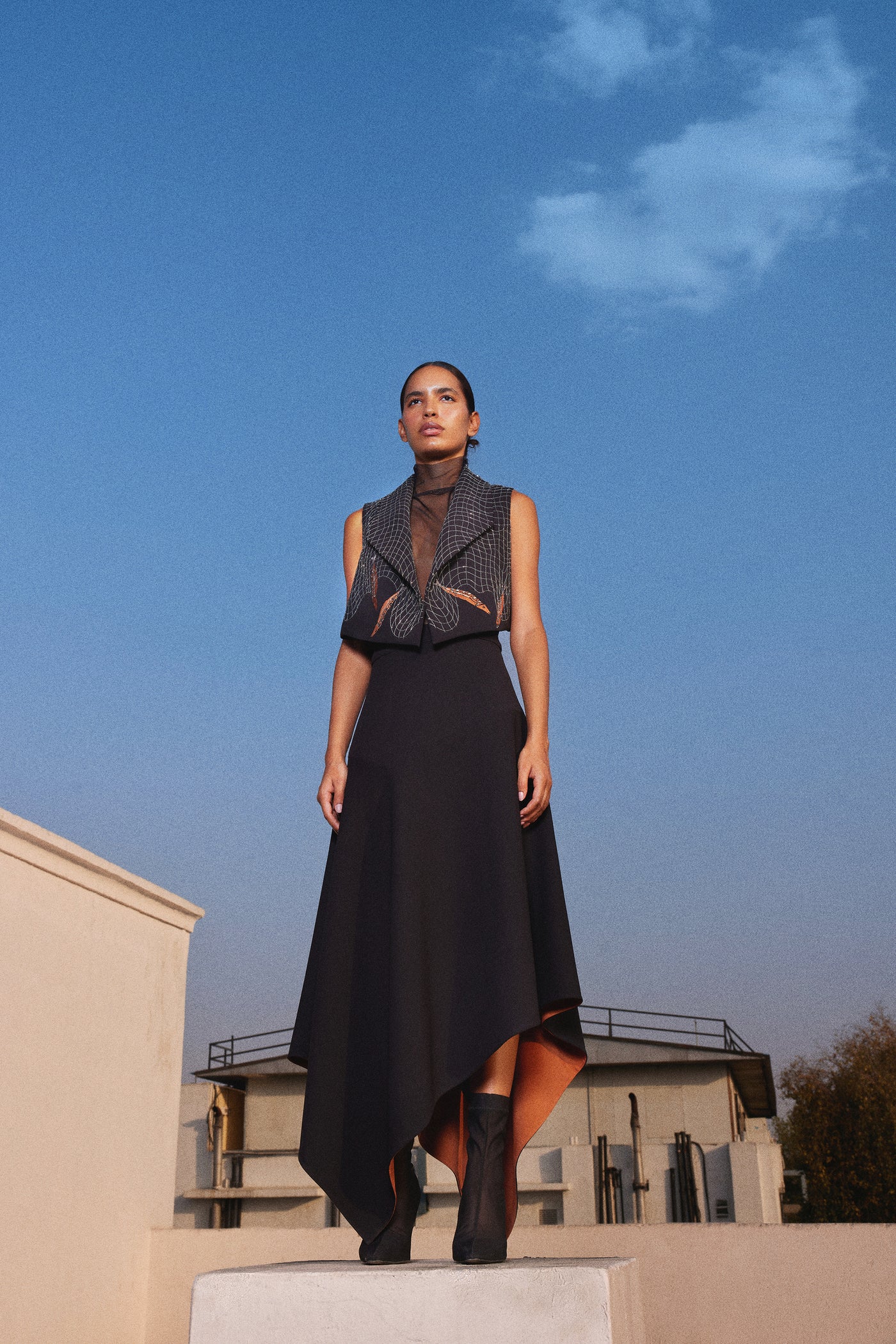 FISH IN THE NET' CROPED SLEEVELESS JACKET WITH ASYMMETRIC SKIRT